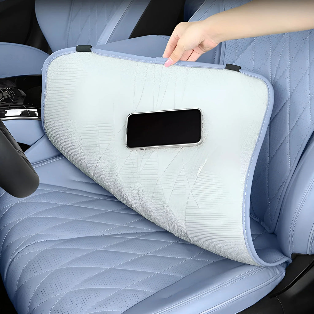 Light blue quilted car seat kick mat with breathable mesh fabric and phone holder pocket.