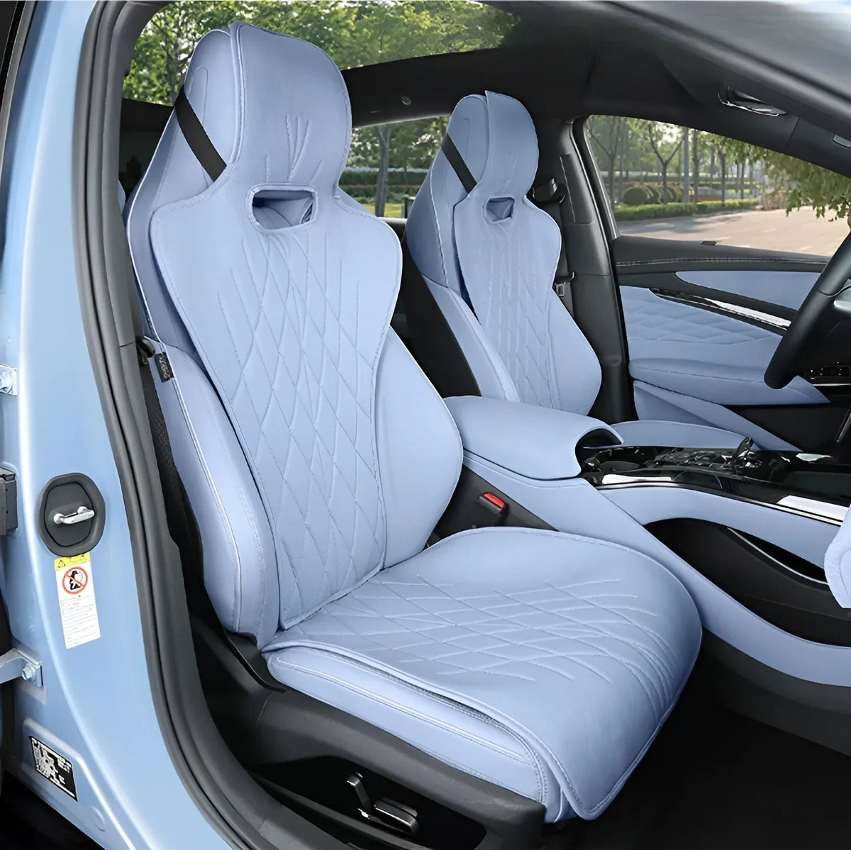 Light blue quilted leather car seat covers with diamond stitching for a luxury interior.