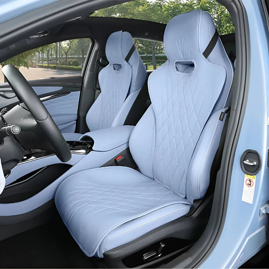 Light blue diamond-stitched leather car seat covers for a modern vehicle interior.