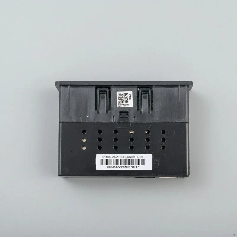 Rear view of a professional black plastic automotive electronics module with white identification labels.