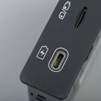 Close-up of a matte black electronic device featuring a USB-C charging port and battery icon.