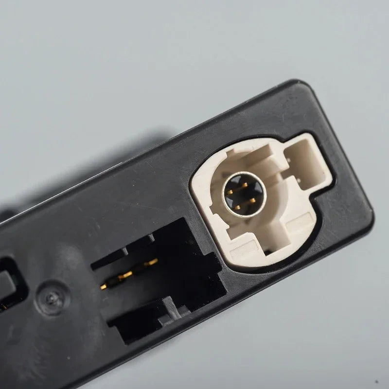 Close-up of a professional black plastic car accessory connector with a white inner socket.
