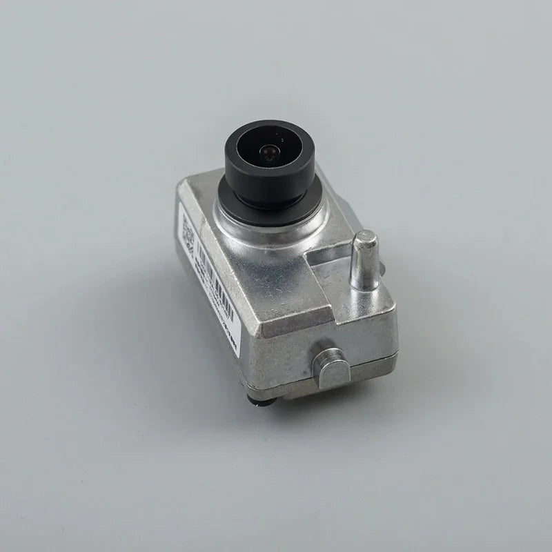 Silver metallic automotive backup camera with a black lens housing and durable casing.