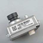 Silver metal automotive sensor with black nozzle and identification label.