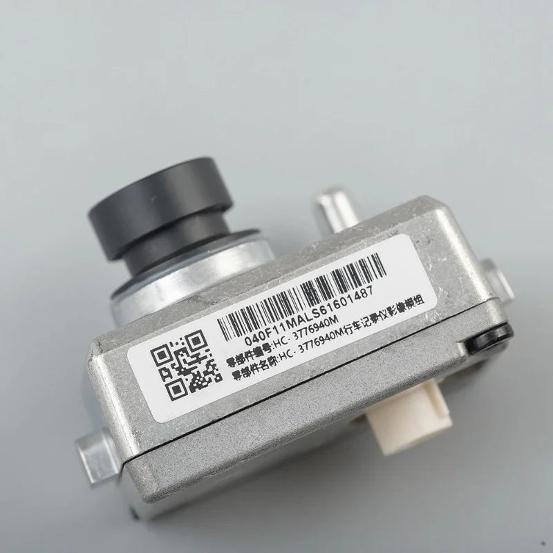 Silver metal automotive sensor with black nozzle and identification label.