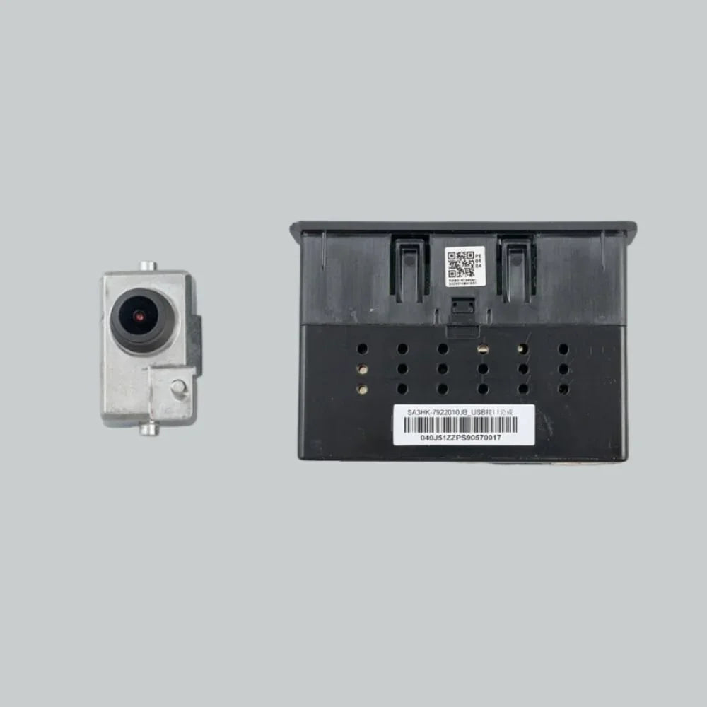 Silver metallic automotive sensor component and black plastic electronic control unit with QR code.