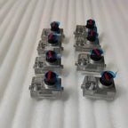 Set of eight silver metal PU3 switches with black buttons and blue protective film.