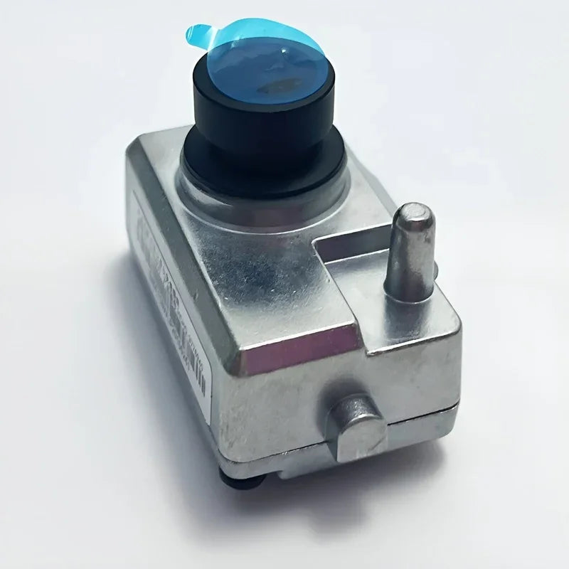 Durable silver metal automotive sensor component with a black circular top and blue protective film.