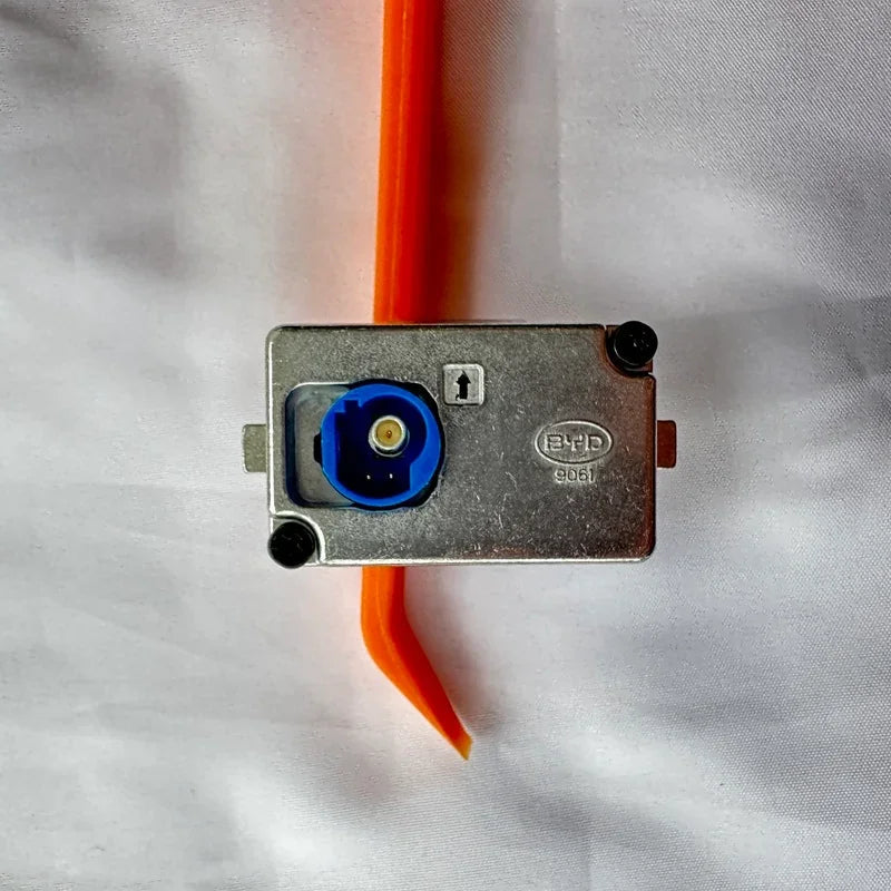 Silver metallic BYD automotive component with a blue circular connector on a white background.