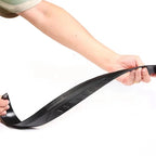 A person holding a flexible black rubber car door weatherstrip seal for vehicle protection.