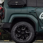 Rugged matte green off-road tire with black and silver alloy rim for BYD accessories.