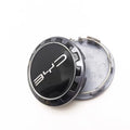 Black and silver metallic BYD wheel center cap accessory with sleek logo design.