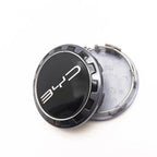 Black and silver metallic BYD wheel center cap accessory with sleek logo design.