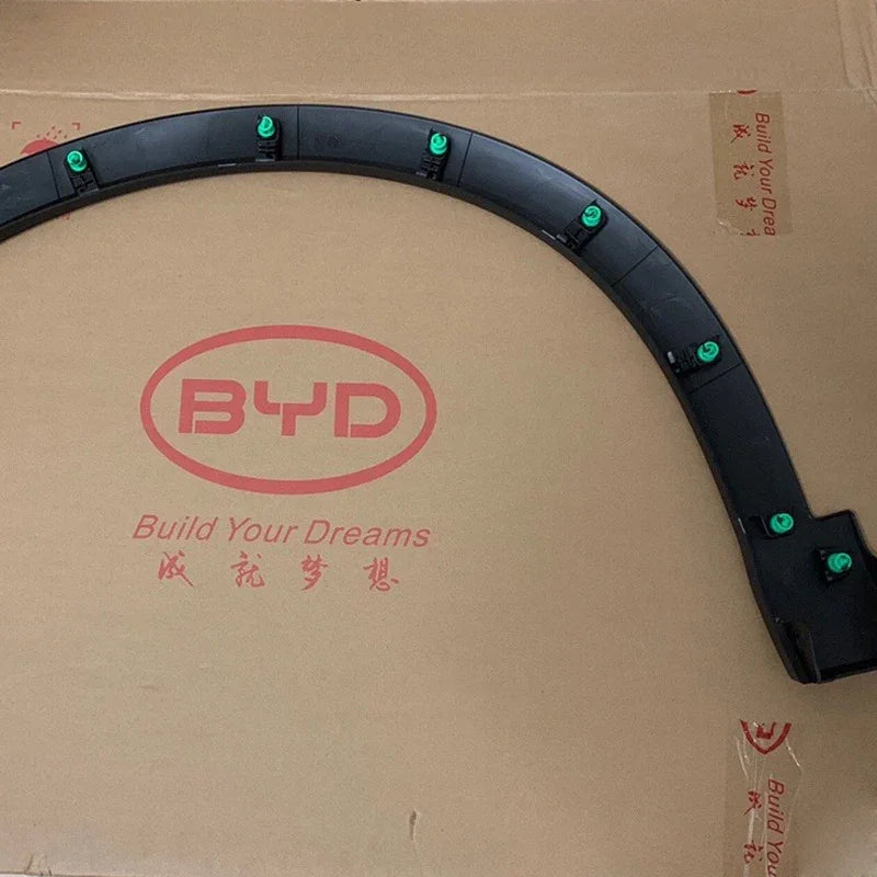 Black durable plastic wheel arch fender flare with green mounting clips for BYD vehicles.