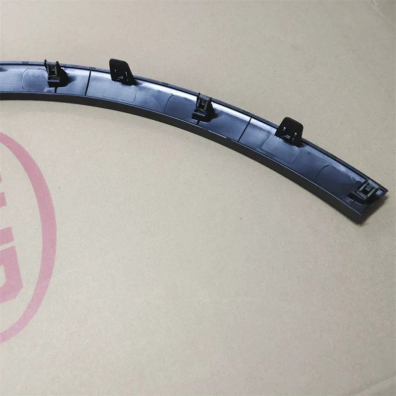 Curved black plastic car trim accessory with durable mounting clips