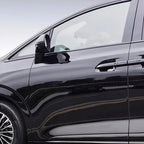 Sleek black car door featuring high-gloss finish and integrated chrome door handle accents.