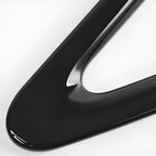 Smooth, glossy black liquid texture with a thick, viscous consistency and reflective surface.