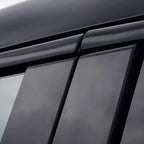 Black sleek window deflectors installed on a car for aerodynamic protection.