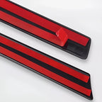 Red and black protective door sill scuff plates for BYD vehicle interiors.