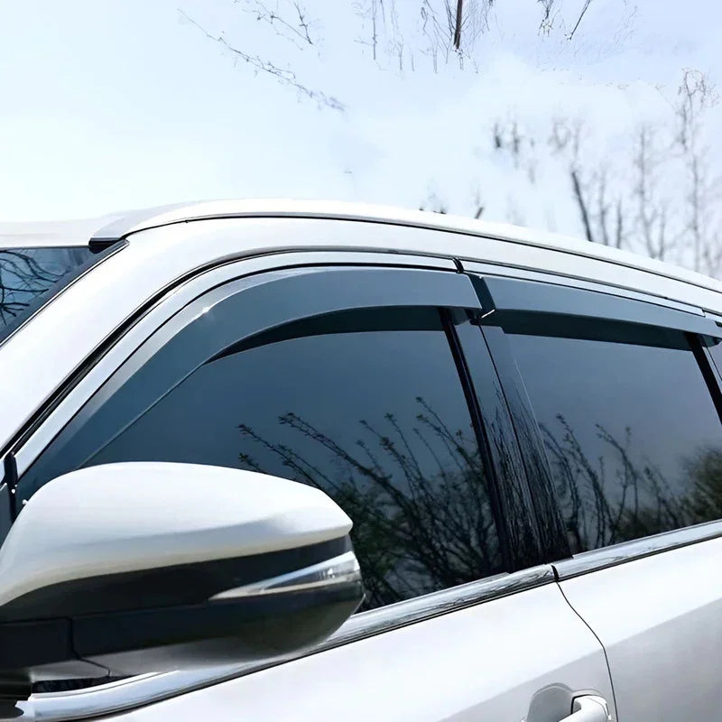 Sleek dark tinted window deflectors installed on a white BYD vehicle side window.