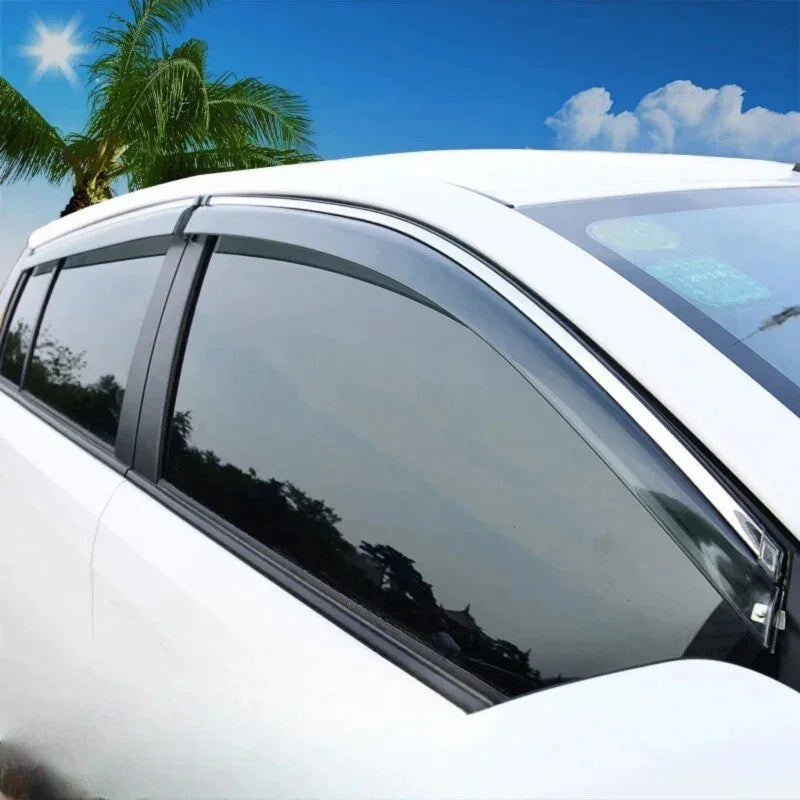 Sleek black tinted window deflectors installed on a white car for enhanced wind protection.