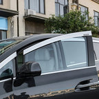 Silver chrome window rain guards installed on a black BYD Denza luxury vehicle.