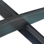 Close-up of glossy black acrylic automotive trim accessories with a sleek, polished finish.