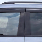Black matte window deflectors installed on a silver BYD vehicle side window.