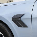 Carbon fiber pattern black fender vent trim for car side panel enhancement.