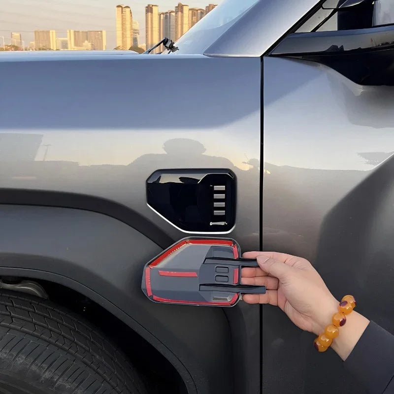 Red-trimmed black carbon fiber style decorative cover for BYD vehicle side vent.