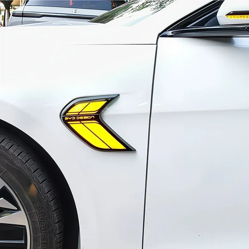Yellow LED side marker light installed on the white fender of a BYD car.