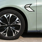Light green BYD car featuring a sleek black and silver multi-spoke alloy wheel and side vent detail.