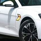 Amber LED side marker light installed on a white car fender for enhanced visibility.