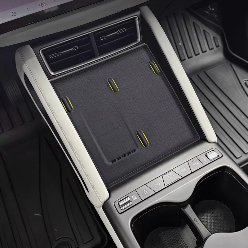 Black textured center console organizer mat with yellow accents for BYD vehicle interior