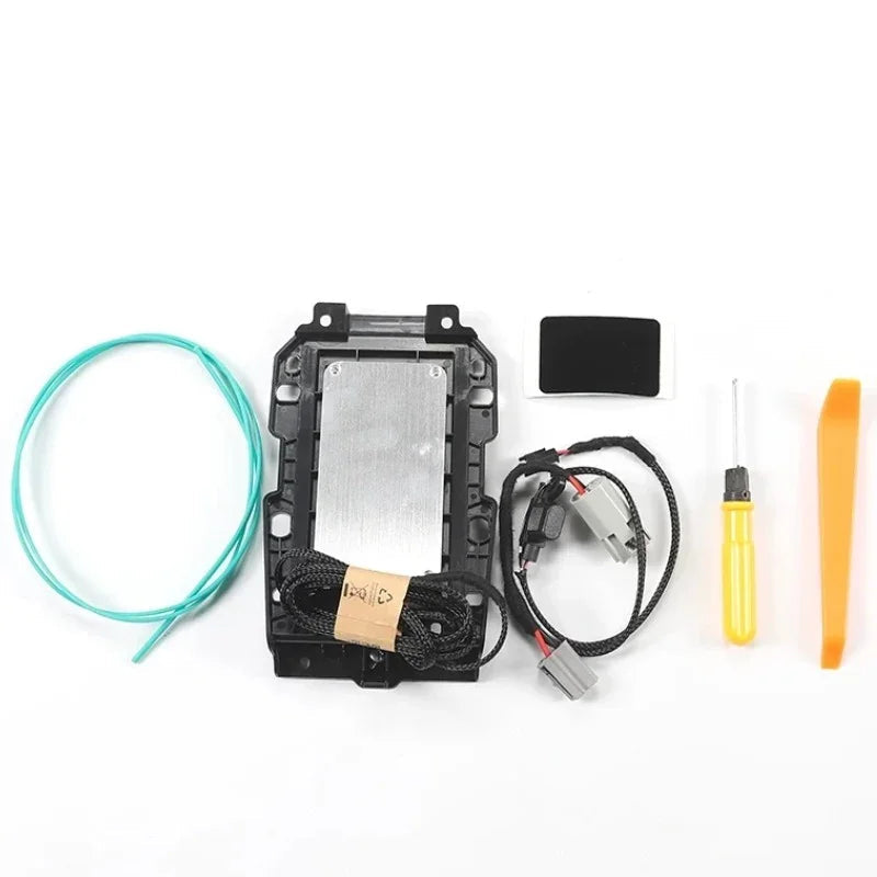 BYD aftermarket accessory kit featuring a black plastic housing, silver metal plate, and teal wiring.