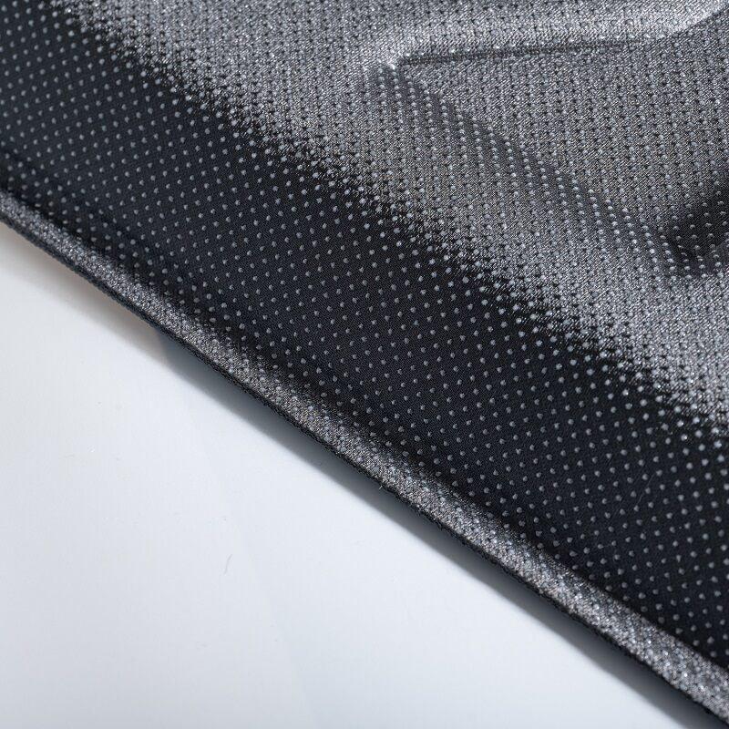 Close-up of a professional grey perforated fabric material for car interior accessories.