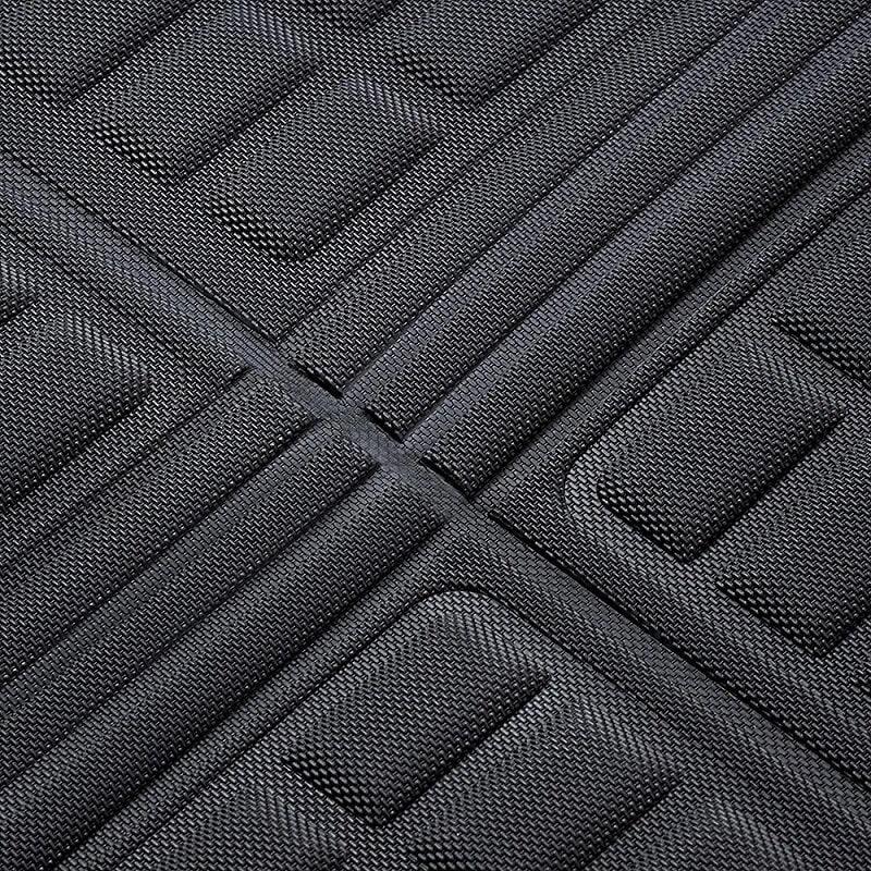 Black textured TPE car floor mat with anti-slip raised patterns for durable protection.