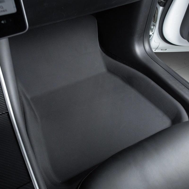 Black textured anti-slip floor mat for car footwell protection.