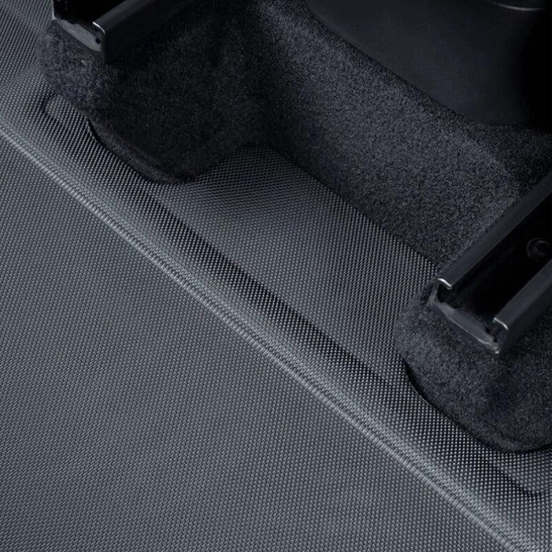 Black textured waterproof car floor mat made of durable high-quality material.