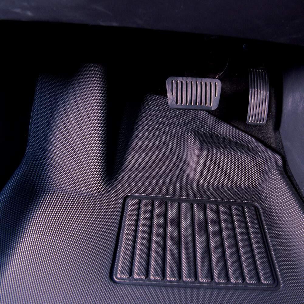 Black textured TPE car floor mats with anti-slip ribbed pattern for BYD interior protection.