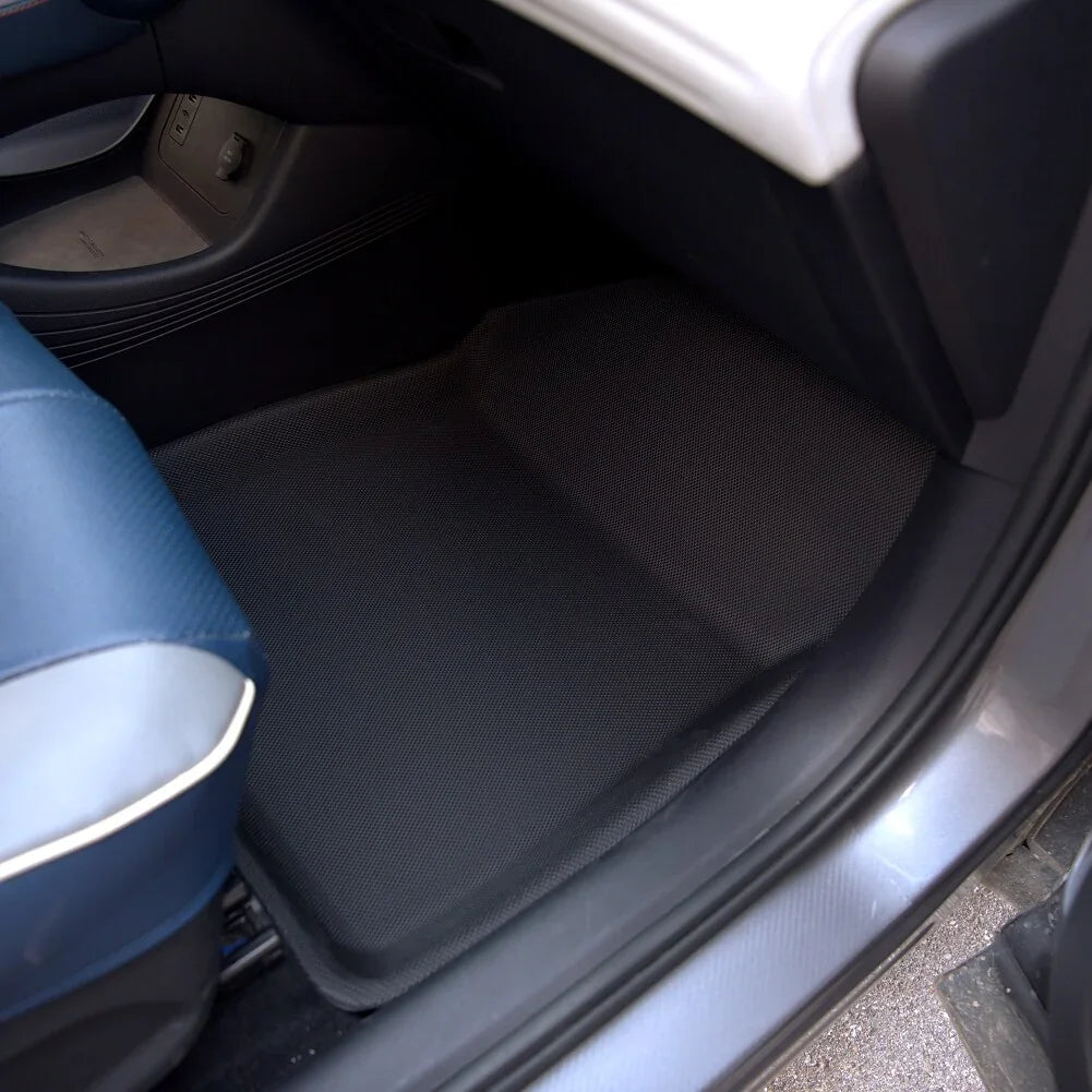 Black textured anti-slip floor mat for car interior protection.