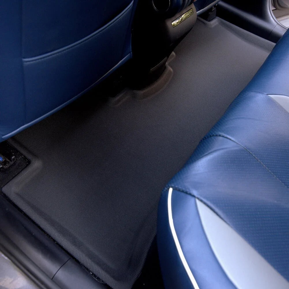 Durable black textured TPE floor mats protecting the vehicle interior from wear and spills.