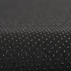 Close-up of durable black waterproof fabric with a textured, water-repellent surface.