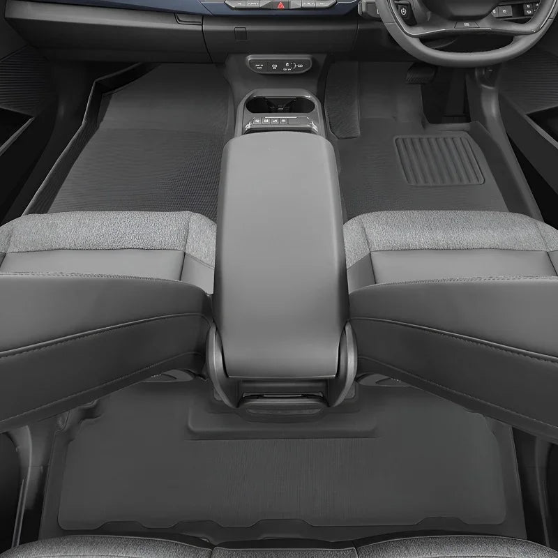 Custom-fit grey TPE car floor mats protecting the interior of a modern vehicle.