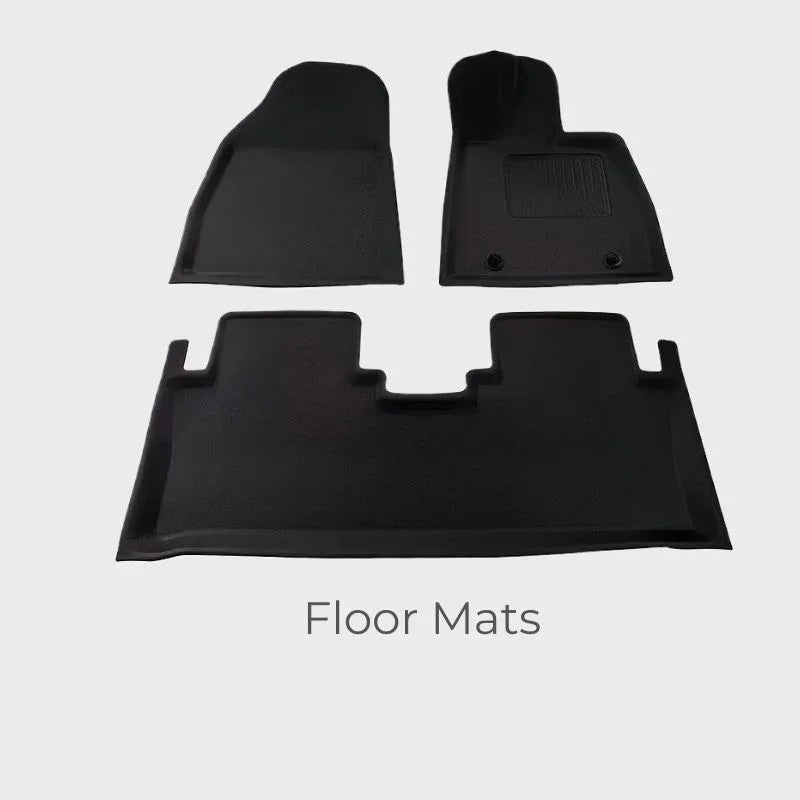 Custom-fit black TPE waterproof floor mats for car interior protection.