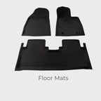 Custom-fit black TPE waterproof floor mats for car interior protection.