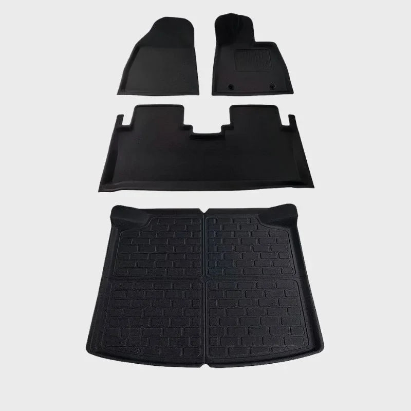 Black heavy-duty rubber car floor mats and trunk liner set for complete interior protection.