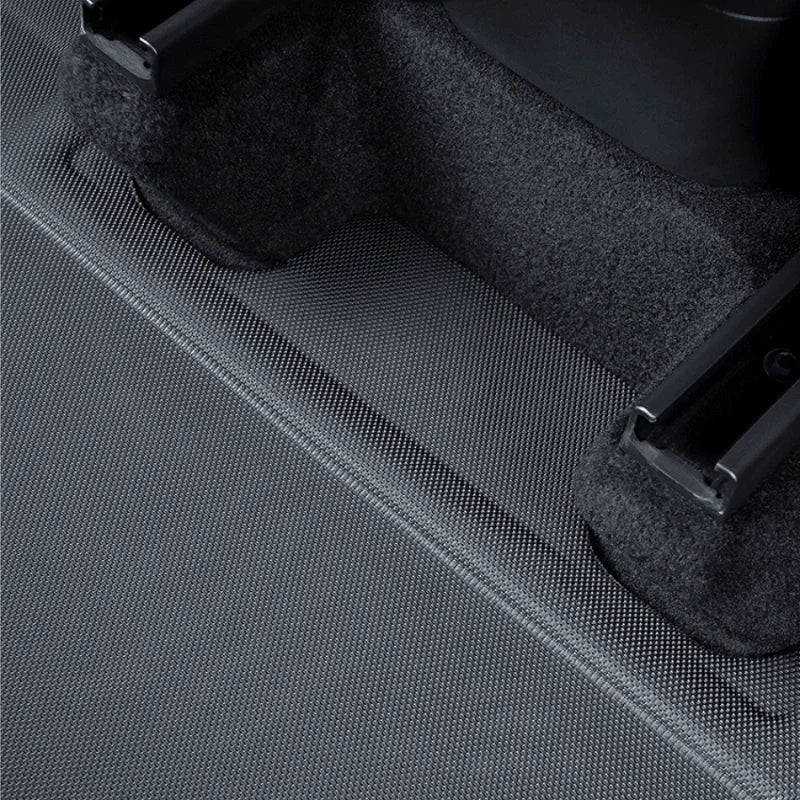 Close-up of a black textured car mat with a durable, water-resistant synthetic material.