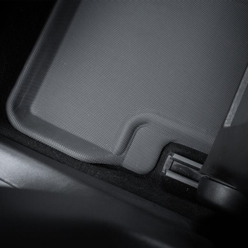 Close-up of a durable grey textured TPE car floor mat with a precise fit.
