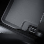 Close-up of a durable grey textured TPE car floor mat with a precise fit.